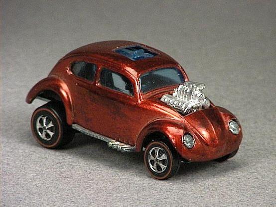 Released in 1968, Spectraflame Orange Custom Volkswagen of 1968 Hot Wheels with Redline wheels. Notes: Exposed engine block and plastic sliding sun roof. US casting has a dashboard, metal engine block, smaller steering wheel and painted silver headlights. Packaging: 1968 Blister. Metal Body, Metal Base. Made in USA. Scarcity: 6/10