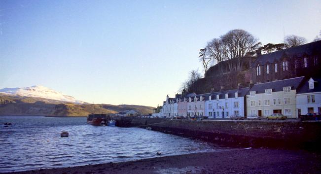 A  harbour wharf, backed by a terrace of houses.