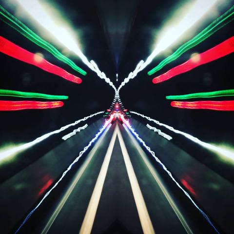 A tunnel vision of neon lights in the night