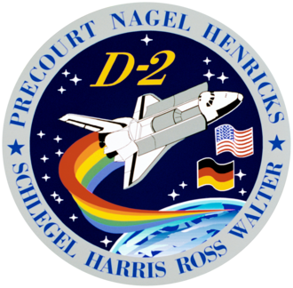Badge circle wirh Shuttle and a rainbow tail.