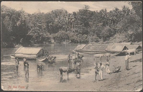 Printed monochrome postcard showing a view of boats, a ferry, cattle and people at the ford across an unnamed river in Ceylon.

Published by Plâté & Co, Ceylon, not numbered, c.1910.

Postally unused.

Fair condition, with some corner wear and scrape to top edge.
