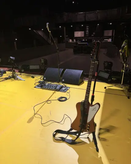 A photo of Hacke's electric bass on stage.