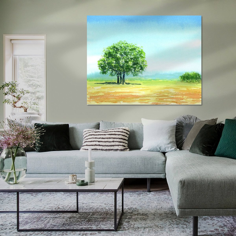 Peaceful Summer Landscape is a watercolor painting in landscape format painted by the artist Karen Kaspar. A blue summer sky stretches across a landscape with cornfields in tones of yellow and ocher in the foreground. The focus of the painting is a group of three trees with fresh green foliage standing close together. Illuminated by the summer sun, they cast cooling shadows on the earth. There are green bushes in the background and blue hills in the distance. Everything is calm and peaceful. The picture radiates a peaceful and relaxing atmosphere.
