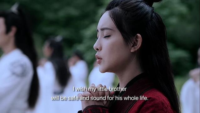 During the Mid-Autumn Festival during the lectures at the Cloud Recesses, Wen Qing - clad in Wen red instead of the white robes of a Gusu Lan guest disciple - closes her eyes while making a wish, clasped hand held tight to her chest:

I wish my little brother will be safe and sound for his whole life.