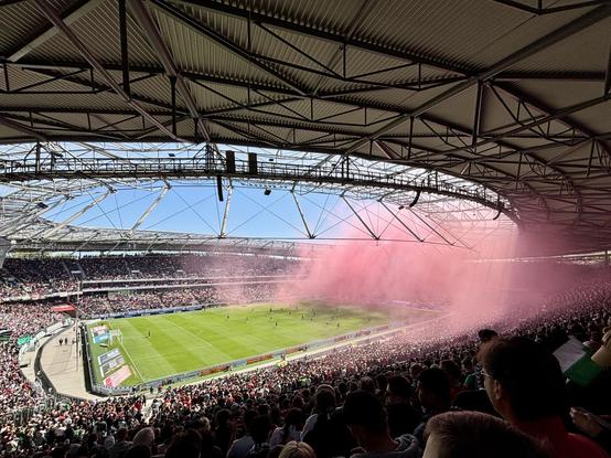 A pink cloud in the stadium after the fireworks