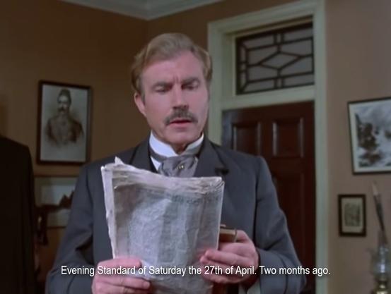 The first man, looking perplexed as he reads a newspaper. “Evening Standard of Saturday the 27th of April. Two months ago.”