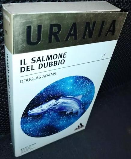 Un volume della collana "Urania" di Ldoiglas Adams, intitolato: "il salmone del dubbio: l'ultima volta in autostop nella galassia".