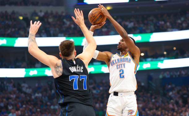 May 18, 2024; Dallas, Texas, USA; Oklahoma City Thunder guard Shai Gilgeous-Alexander (2) shoots over Dallas Mavericks guard Luka Doncic (77) during the first quarter in game six of the second round of the 2024 NBA playoffs at American Airlines Center. Mandatory Credit: Kevin Jairaj-USA TODAY Sports