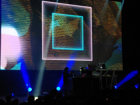 Visuals out of patters of letters and some moving squares overlaid.