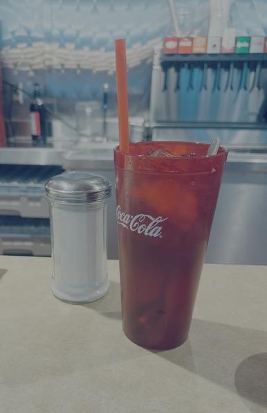 The American Urge to drink unsweetened iced tea from a dinner.