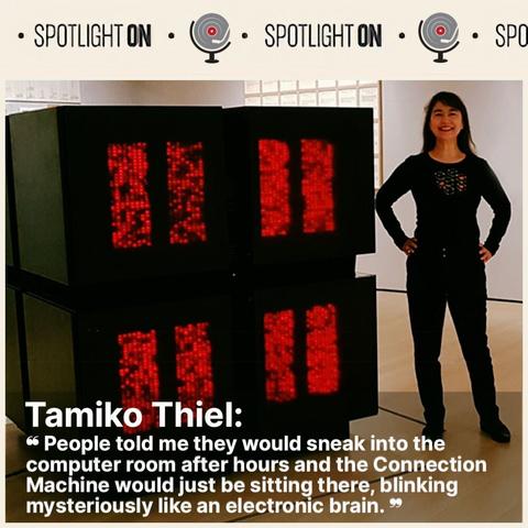 A photo of Tamiko Thiel standing in front of the red, glowing, cube-like Connection Machine.