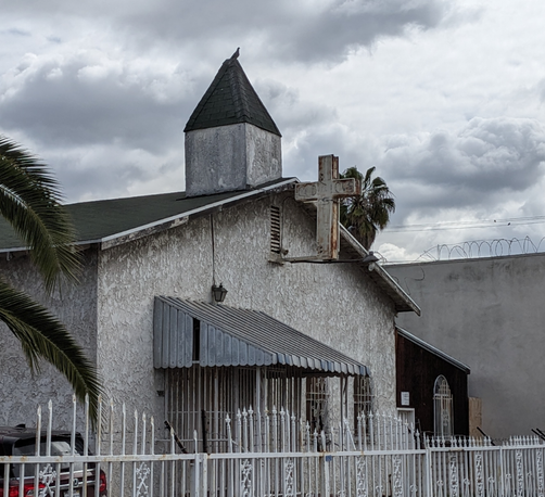 Older dilapidated church, all in white