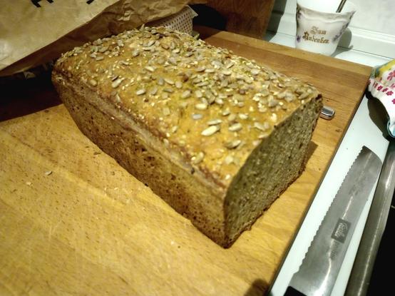 a bread with sunflower seeds sprinkled on top
