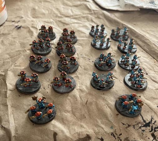 Legion Imperialis Mechanicum miniatures. 

All using speed paints, Caribbean Ocean and Nuclear Sunrise with Hoplite Gold accents. 

8 squads of thralls
8 squads of Tharax jump troops
2 Tech-Priests with drones.