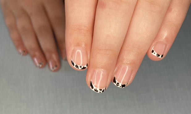 Little hands with a French tip in white/black cow print