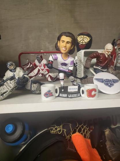 This shrine lives in a 50+ men's league locker. RIP