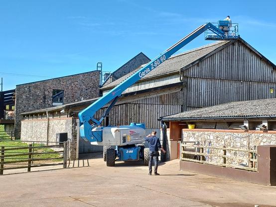 A blue cherry picker, type Genie Z80/60. Donkey Sanctuary, Sidmouth.