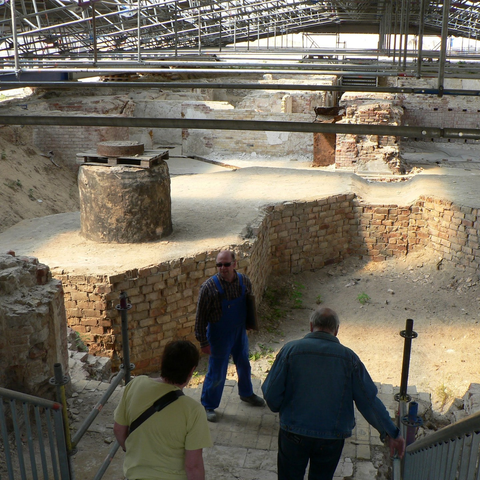covered archaeological site of Berliner Schloss, showing tour participants