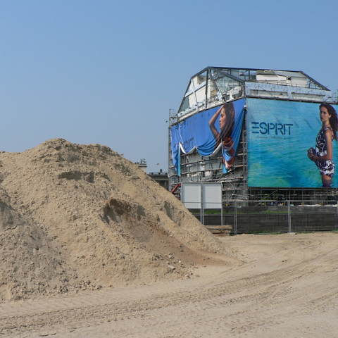 exposed construction site, with temporary "Humboldt Box"  under construction in the background
