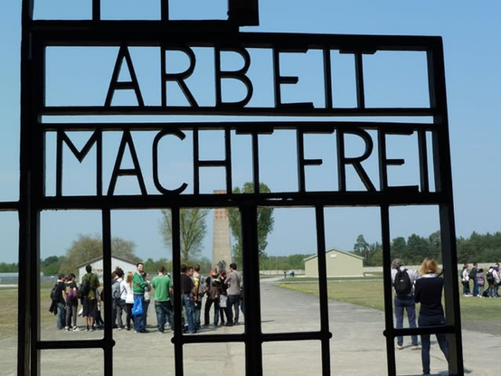 detail of the iron gate at the entrance of Sachsenhausen, with the words "Arbeit Macht Frei"