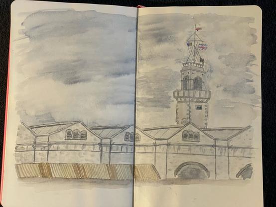 Aufgeschlagenes Sketchbook mit Aquarellzeichnung der alten Navy Base in Gibraltar.