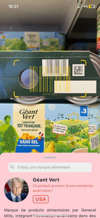 This screenshot of the mobile app shows an image of a canned corn from the supermarket and, below, there is a red information box that says the product is from the USA.