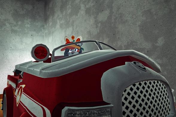 The photo shows an anthropomorphic animal (possibly a wolf or fox) wearing a hat and sitting in a toy firetruck. The setting appears to be a simple, textured background suggesting a possibly digital or rendered image.