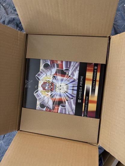 Photo of the internal cardboard box for Haslab Transformers Omega Prime, showing how it’s been padded inside a second box for protection.