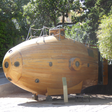 A wooden bathysphere in the courtyard of the Museu Marítim de Barcelona