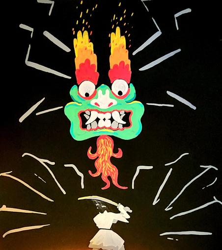 A pesky samurai standing in front of Aku whose hands are drawing near.
Photo with a lamp near the bottom and then contrast adjustments to get a deeper black.