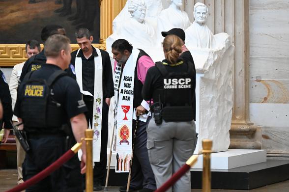 A photo of William Barber and clergy being arrested