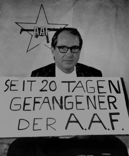 Parodie des berühmten Fotos des von der RAF entführten Hans-Martin Schleyers. Sein Gesicht wurde durch das von Alexander Dobrindt ersetzt, der Text auf dem Schild vor ihm wurde zu "Seit 20 Tagen Gefangener der A.A.F." abgeändert,
das Logo der RAF im Hintergrund wurde dahingehend abgeändert, dass auf der Maschinenpistole im fünfzackigen Stern nun der Schriftzug "AAF" zu lesen ist