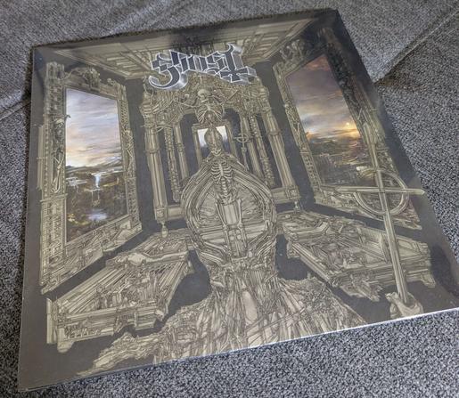 a vinyl record with skeletal gray artwork on the cover

it is Ghost's new Perpetua album!