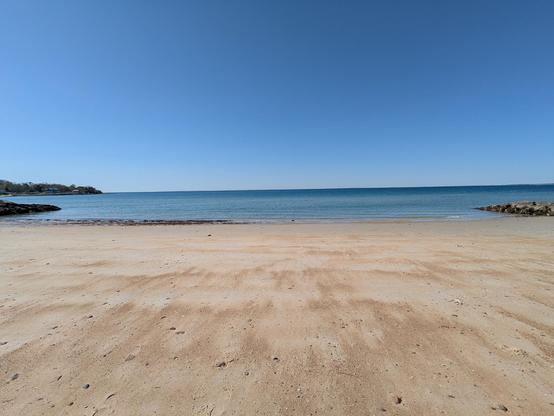 A landscape photo of a beach in New England.