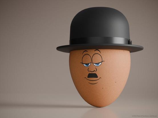 Light brown egg with a bowler hat and a Charlie Chaplin face.