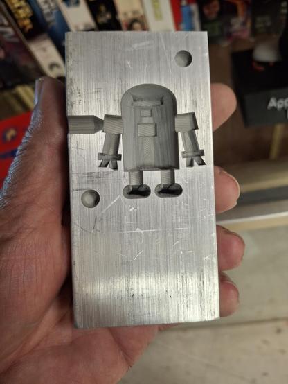 the same mold half, held in my hand showing the details of the embossing job.