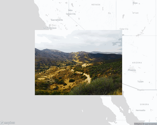 A photo of or from a park from the linked website, overlaid on a cropped world map where it's located.