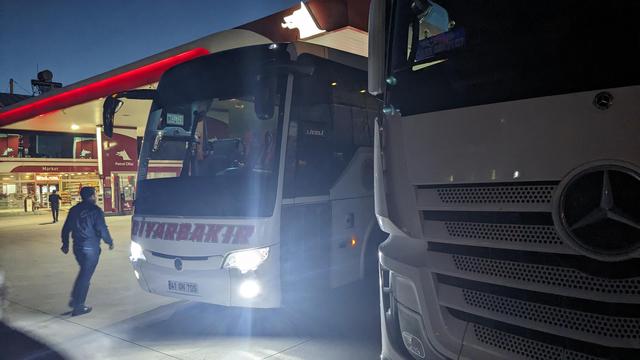 A bus on a parking in dusk.
