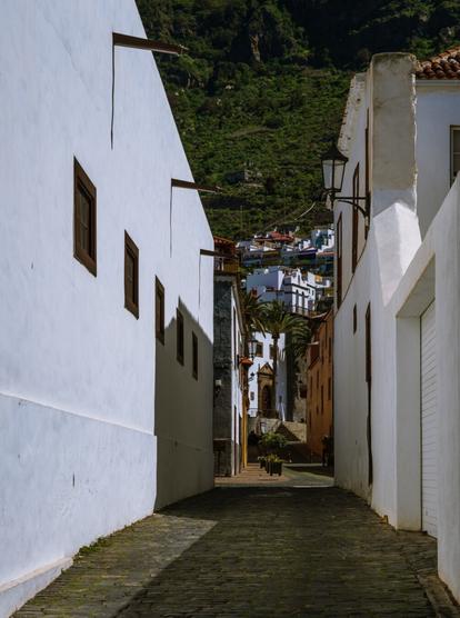 Narrow white washed alley leading to historic Parroquia de Santa Ana in Garachico, North Tenerife, Canary Islands 
Captured by Komeil Karimi