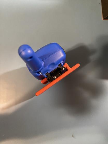 a little FRS radio with its belt clip on a custom printed set of connected rounded slabs