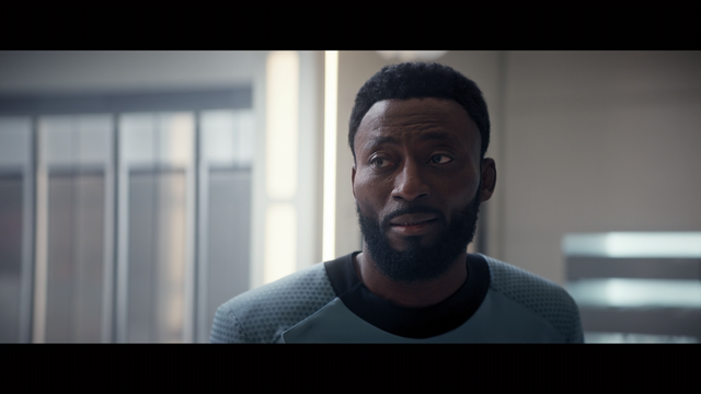 A close-up shot of M'Benga in sickbay on the Enterprise.  From Star Trek Strange New Worlds E208