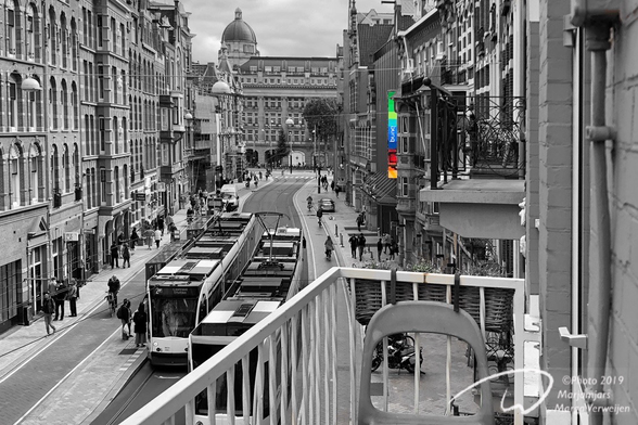 Here is when I attended another update from online digital bank bunq back in 2019 in Amsterdam, The Netherlands. Their logo shows on the right in front of the De La Mar Theatre. The building with the dome houses the Amsterdam Apple Store. Trams find their way through the narrow street and old houses.