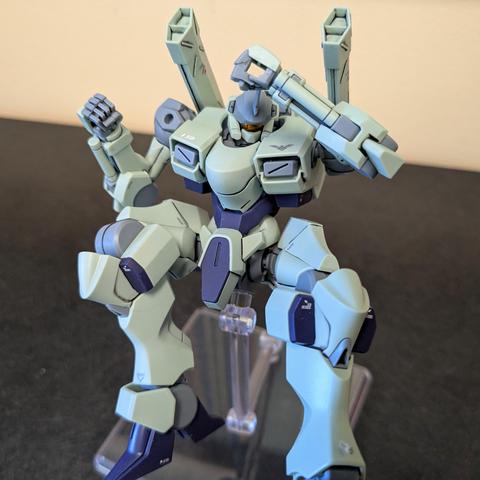 The HG Zowort on a stand in a defensive falling posture. You can clearly see many of the added decals (including the one ripped partially off from the first pose, on its left ankle)