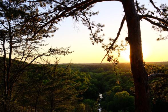 View of the sunset over the Eno river from an overlook