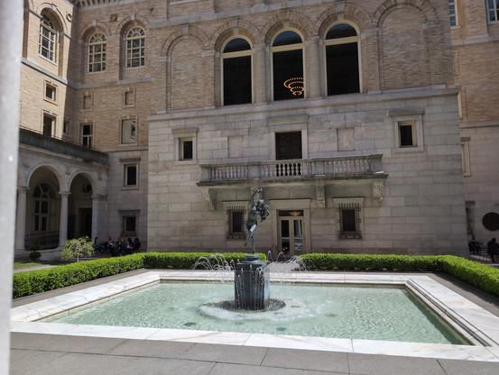 Courtyard at the Boston Public Library. Beautiful, quiet space in the middle of the Back Bay.

In the center of the space is a bronze statue set in a reflecting pool with a fountains of water spring up about its base. 

Not audible as it's a photo is the quiet of the place with the sound of the fountain in the background.