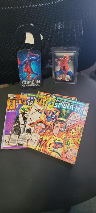 Spider-Man Comics, Door Hanger, and Light Switch Cover on my Computer Chair.