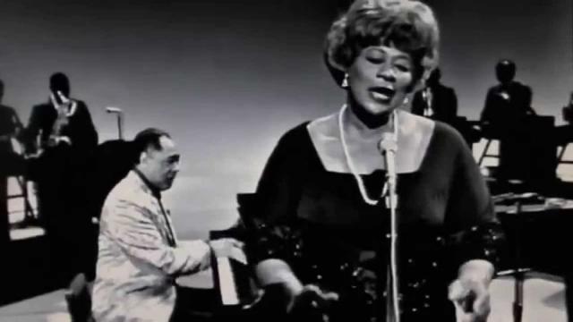 Duke Ellington performing with "It Don't Mean a Thing" with Ella Fitzgerald