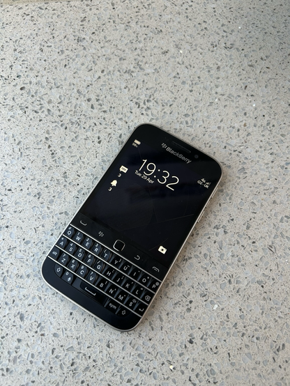 A  BlackBerry Classic mobile phone showing the Lock Screen.