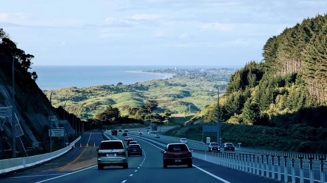 View as we descend north on Transmission Gully (SH1) with the wonderful coastal view laid out before us.