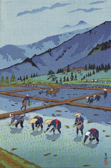 Spring in a mountain village somewhere in Japan. Villagers in broad bamboo hats plant rice in a flooded paddy; beyond, farmhouses stand tucked in among trees at the base of the mountains. Further on, the forested peaks of mountains are obscured by mist. Above, the sky is pale blue with a few stray clouds passing by.